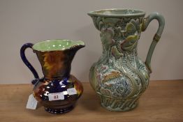 A Maling Art Deco lustre jug, storm pattern, measuring 17cm tall, and a Beswick Ware pitcher, of