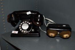A 1930s black bakelite telephone