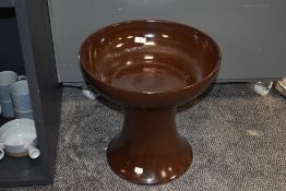 A vintage brown glazed stoneware jardiniere stand and pedestal.