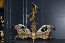 A reproduction Art Nouveau cast brass and porcelain centre piece having winged figure of victory