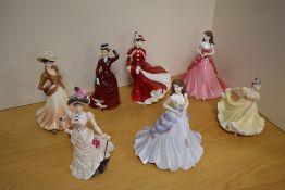 A Group of three Royal Doulton bone china figurines, comprising 'Christmas Day' HN4552 (marked as