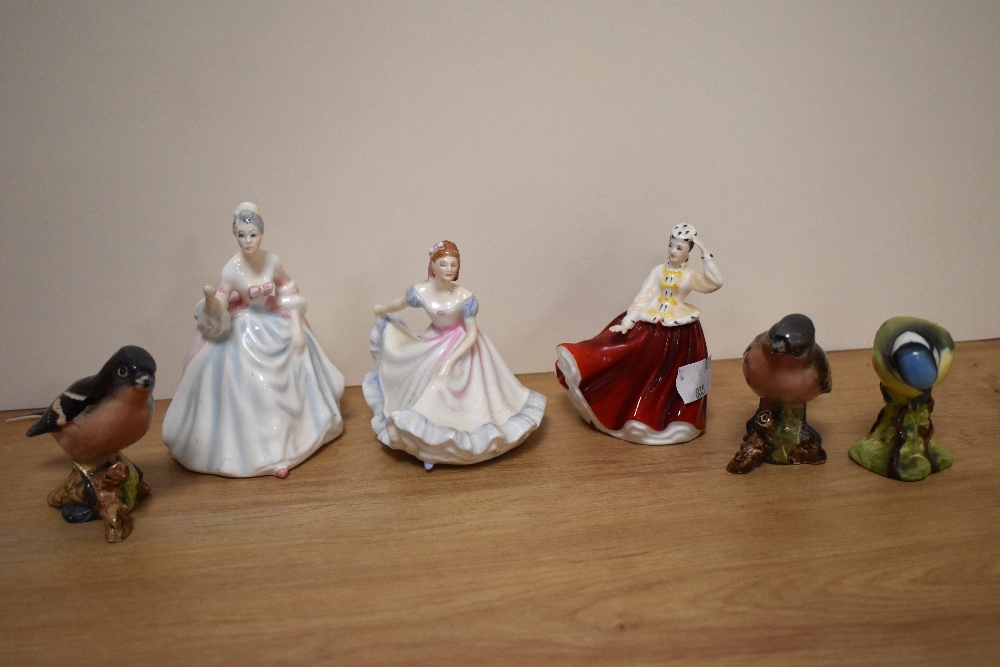 A group of three small Royal Doulton bone China figurines, Ninette HN3215, Gail HN3321 and Diana