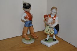 A pair of Hungarian Herend hand-painted Porcelain figures, formed as continental children in