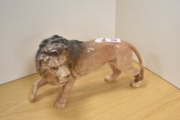 A Beswick Pottery wild animal study of a lion, standing 2254B in golden brown gloss, designed by