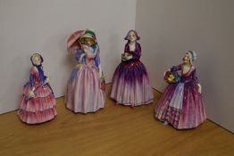 A group of four Royal Doulton bone china figurines, comprising 'Miss Demure' HN1402, 'Janet' HN1538,