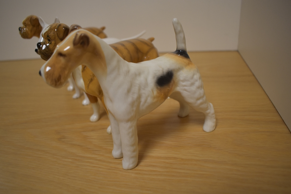 A Group of four Beswick Pottery Dog studies, comprising two Boxers 'Blue Mountain Greta' 1202, in - Image 2 of 4