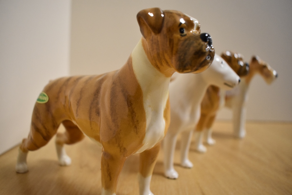 A Group of four Beswick Pottery Dog studies, comprising two Boxers 'Blue Mountain Greta' 1202, in - Image 3 of 4