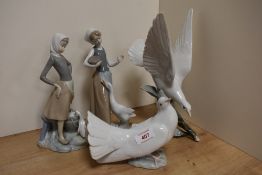 A group of four Lladro studies and figurines, including two girl with geese figurines and two dove