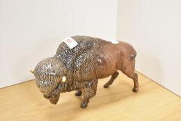 A group of three Beswick Pottery wild animal studies, comprising 'Bison' 1019 in dark brown gloss,