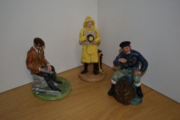 A group of three Royal Doulton bone china figures, comprising 'The Lobster Man' HN2317, 'Lifeboat