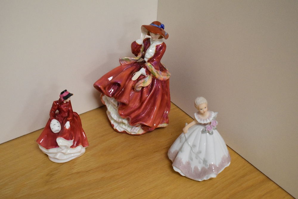 A group of two Royal Doulton bone china figurines, comprising 'Top O' The Hill' HN1834, and 'Emma'