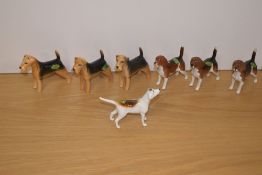A group of seven Beswick Pottery dog studies, comprising three small Beagles 'Wendover Billy' number