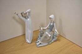 Two Lladro porcelain figures, 'Shepherdess with Dove' 4660 and 'Boy Yawning' 4870