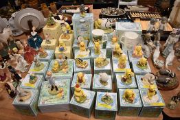 An extensive collection of thirty three Royal Doulton 'The Winnie-The-Pooh' collection figures and