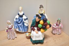 A group of five Royal Doulton bone china figurines, comprising 'The Old Balloon Seller' HN1315, '