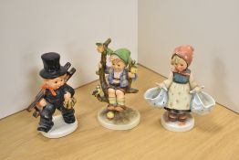 A group of three Goebel porcelain 'Hummel' figures and figurines, comprising 'Chimney Sweep with