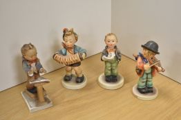 A group of four Goebel porcelain 'Hummel' figures and figurines, comprising 'Little Fiddler', '