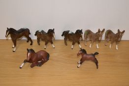 Two Beswick Pottery 'Donkey Foals' number 2110 in grey/brown gloss, designed by Graham Tongue 11.
