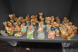 A group of forty four 'Pendelfin' hand-painted Stonecraft humorous rabbit figures, to include '