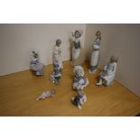 A group of three Lladro porcelain figures/studies, comprising a young Inuit child with polar bear