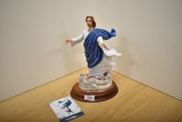 A Franklin Mint hand decorated bisque porcelain figure of Raphael's'The Transfiguration' resing on a