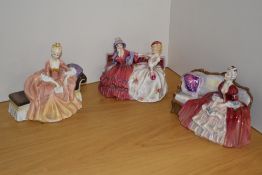 A group of three Royal Doulton bone china seated figurines, comprising 'Reverie' HN2306, 'The