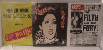 A lot of three canvas prints featuring Sex Pistols ( 2 ) and X-Ray Spex - all measuring 40cm x 50cm
