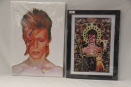 A lot of two David Bowie items - a framed print measuring 35cm x 47cm and a canvas 35cm x 51 cm -