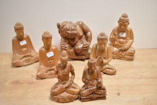 An assorted collection of carved wooden deity ornaments, including a pregnant nude, 18cm tall