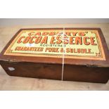 A vintage stained wood confectionary box, 'Cadbury's Cocoa Essence', measuring 10cm x 10cm x 38cm