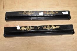 Two vintage lacquered oriental desk top pen trays.