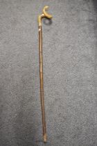 A vintage hazel walking stick having horn handle.