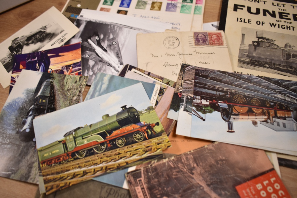 An assorted collection of vintage postcards, illustrating locomotives and planes, stamps, and a - Image 2 of 2