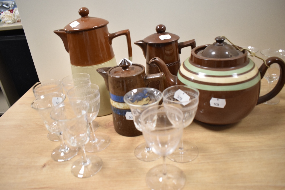 A 20th century teapot having brown glaze and mint and cream bands, similar lidded jug and two