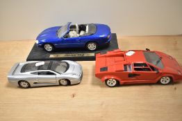 Three large scale model diecast cars by Maisto and Polistil