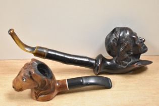 A hand carved imported briar pipe in the form of a horses head and another similar in the form of