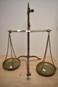 A set of 1920s brass balancing scales, impressed mark for Doyle and Son, London.