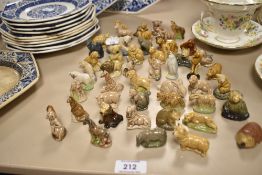 A menagerie of Wade whimsies, including hedgehog, dogs and otter, over forty pieces.