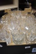 A box full of vintage drinking glasses, including rummers and wine glasses.