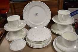 A selection of Susie Cooper cups and saucers, plates and sugar basin, having white ground with