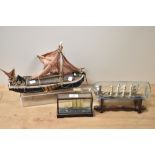 A ship in a glass bottle, a model boat af, and similar.
