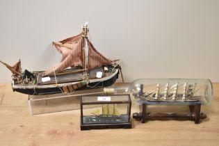 A ship in a glass bottle, a model boat af, and similar.