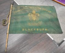 An early 20th century large Boy Scout flag reading 'Catherdral Mission Troops, Blackburn', having