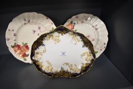A Doulton Burslem blue gilt dish and a pair of Royal Doulton Wrenbury patterned dishes