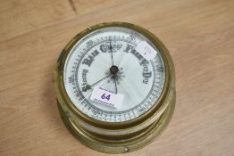 A brass cased ship's barometer.