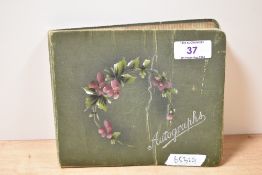 An early 20th century autograph book, containing various ditties and verse, including entries during