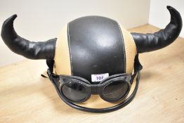 A novelty stitched leather viking style motorcycle helmet