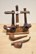 A vintage novelty pipe stand, in the form of an anchor, with applied 'HMS Victory' plaque,