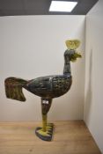 A hand painted wooden cockerel ornament, of primitive appearance, measuring 62cm tall
