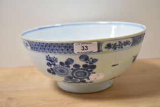 A 19th century Chinese export blue and white bowl, decorated with floral vignette and Diaper